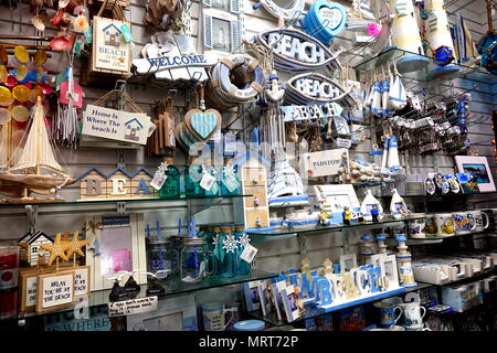 Padstow, Cornwall, April 11th 2018: Selection of seaside, beach or coast related gift items in a shop display Stock Photo