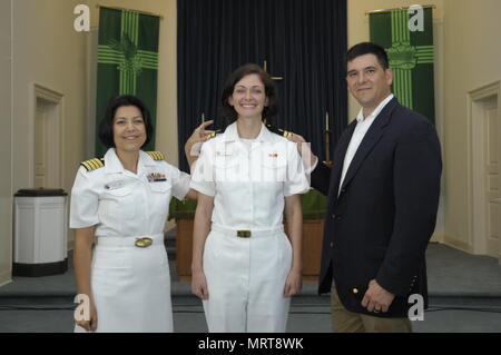 CORPUS CHRISTI, Texas (June 30, 2017) Naval Health Clinic (NHC) Corpus Christi Senior Nurse Executive (SNE), Capt. Kimberly Taylor, and Family Nurse Practitioner (FNP) Lt. Brittany Garza with her husband, Jose Garza, during her promotion ceremony at the Naval Air Station Corpus Christi Protestant Chapel June 30. (U.S. Navy photo by Bill W. Love/RELEASED) 170630-N-KF478-012 Stock Photo