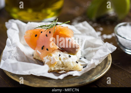 Finger Food Smoked Salmon Canape with Cream Cheese, Fresh Dill and Black Sesame Stock Photo