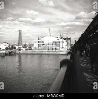 1960, historical, view from Hungerford Bridge from across the river Thames, of the Royal festival hall, London, England. Built in 1951, this was a major arts venue on the Southbank of the River Thames. On the left is the brick-built shot tower of the Lambeth lead works, which although a prominent london landmark was demolished later in the decade. Stock Photo