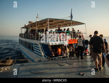 170703-N-ME396-008 HAIFA, Israel (July 3, 2017) Sailors board a water taxi to travel from the aircraft carrier USS George H.W. Bush (CVN 77) to Haifa, Israel. The ship is in Haifa for a scheduled port visit to enhance U.S.-Israel relations. (U.S. Navy photo by Mass Communication Specialist 3rd Class Tristan B. Lotz/Released) Stock Photo