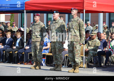 Col. James B. Bartholomees III (right), incoming commander of the 173rd Airborne Brigade, Maj. Gen. Timothy P. McGuire (center), Deputy Commanding General, U.S. Army Europe and Col. Gregory K. Anderson (left), outgoing commander during the Change of Command Ceremony at Caserma Del Din in Vicenza, Italy, July 7, 2017. The 173rd Airborne Brigade, based in Vicenza, Italy, is the Army Contingency Response Force in Europe, and is capable of projecting forces to conduct the full of range of military operations across the United States European, Central and African Command’s areas of responsibility.  Stock Photo