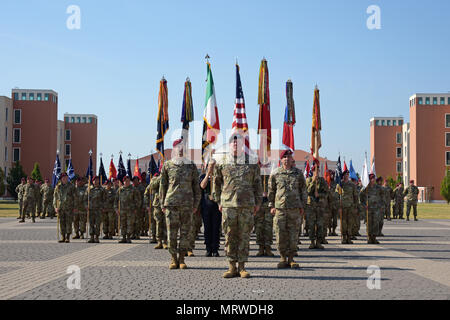 Col. James B. Bartholomees III (left), incoming commander of the 173rd Airborne Brigade, Maj. Gen. Timothy P. McGuire (center), Deputy Commanding General, U.S. Army Europe and Col. Gregory K. Anderson (right), outgoing commander, during the Change of Command Ceremony at Caserma Del Din in Vicenza, Italy, July 7, 2017. The 173rd Airborne Brigade, based in Vicenza, Italy, is the Army Contingency Response Force in Europe, and is capable of projecting forces to conduct the full of range of military operations across the United States European, Central and African Commands’ areas of responsibility. Stock Photo