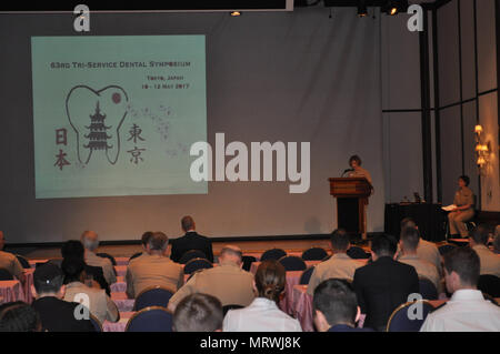 TOKYO, Japan (May 10, 2017) – U.S. Naval Hospital (USNH) Yokosuka Commanding Officer, Capt.  Rosemary Malone, delivers opening remarks during the 63rd Tri-Service Dental Symposium held at the New Sanno Hotel.    The 63rd Tri-Service Dental Symposium was held from May 10-12, 2017 and was hosted by USNH Yokosuka.  Approximately 120 dental providers from the Army, Navy, Air Force, Japan Self Defense Force, and local host nation community attended the three day event.  (U.S. Navy photo by Lt. Paul Tan/Released) Stock Photo