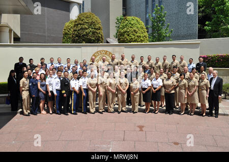 TOKYO, Japan (May 12, 2017) – Medical professionals and attendees of the the 63rd Tri-Service Dental Symposium held at the New Sanno Hotel pose for a group photo after the conclusion of the symposium.    The 63rd Tri-Service Dental Symposium was held from May 10-12, 2017 and was hosted by USNH Yokosuka.  Approximately 120 dental providers from the Army, Navy, Air Force, Japan Self Defense Force, and local host nation community attended the three day event.  (U.S. Navy photo by Lt. Paul Tan/Released) Stock Photo