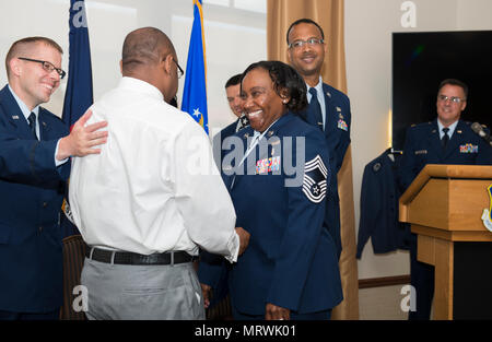 Former Senior Master Sgt. Francenia Reed-McKnight, is promoted to the rank of Chief Master Sgt. during an official ceremony, July 8, 2017, Niagara Falls Air Reserve Station, N.Y. Reed-McKnight is the first member of the Force Support Squadron to be promoted from within the squadron to the rank of Chief since its inception. (U.S. Air Force photo by Tech. Sgt. Stephanie Sawyer) Stock Photo