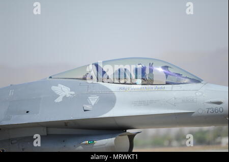 A pilot assigned to the 310th Fighter Squadron taxis down the runway after a safe landing in an F-16 Fighting Falcon at Luke Air Force Base, Ariz., July 7, 2017. The Lockheed Martin F-16 Fighting Falcon represents the full range of capabilities possessed by the Air Force's tactical fighters. This highly-maneuverable multi-role fighter has proved to be one of the world's best precision tactical bombers and air-to-air combat aircraft. (U.S. Air Force photo by Airman 1st Class Caleb Worpel) Stock Photo