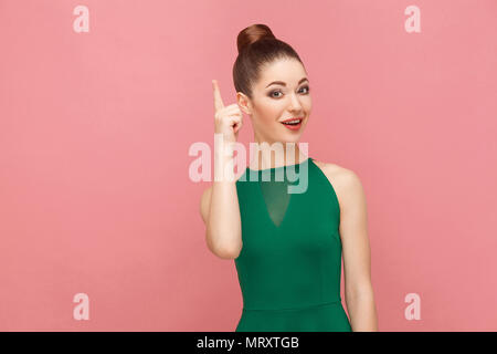 Happiness woman have great idea. Expression emotion and feelings concept. Studio shot, isolated on pink background Stock Photo