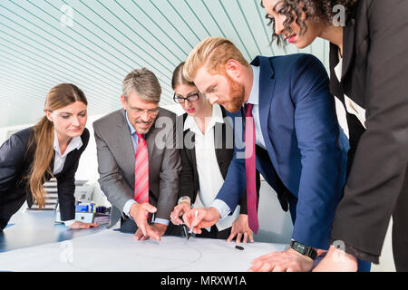 Group of business people analyzing data Stock Photo