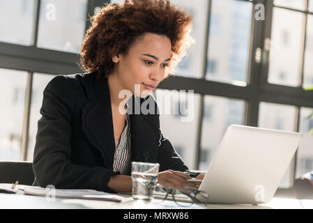 Expert analyzing business report in the office Stock Photo