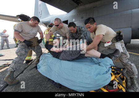 Major Accident Response Exercise is a bilateral emergency preparedness drill conducted at Yokota Air Base involving U.S. and Japanese air forces. The archival image documents coordinated casualty handling during simulated aircraft accident training on July 10, 2017. The historical photographic print records multinational emergency response cooperation. Stock Photo