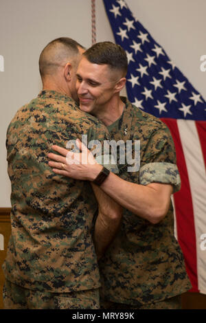 U.S. Marines, family and friends gather for Maj. Gen. Robert F. Castellvi's promotion ceremony on Camp Lejeune, N.C., 11 July, 2017. Castellvi was promoted from Brigadier General to Major General by Maj. Gen. Walter L. Miller. (U.S. Marine Corps photo by Lance Cpl. Taylor N. Cooper) Stock Photo