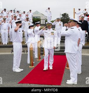Naval Ocean Processing Facility Whidbey Island is a United States Navy shore command responsible for processing undersea surveillance data in support of fleet operations. On 13 July 2017 in Oak Harbor, Washington, a change of command and retirement ceremony marked the transfer of leadership at the facility. The archival image documents ceremonial honors and command transition procedures at the installation. Stock Photo