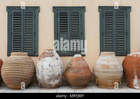 Massive traditional ceramic vessels in front of the building of Psaropoulos Museum of Traditional Pottery in Athens. Stock Photo