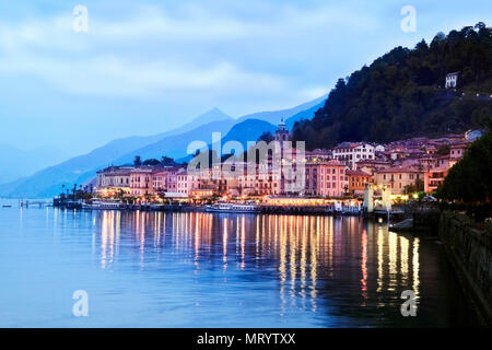 The lights of Bellagio reflect in the calm waters of Lake Como in northern Italy. Stock Photo