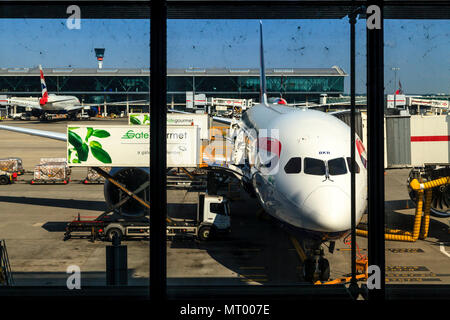 A British Airways Plane Being Serviced At Heathrow Airport, London, UK Stock Photo