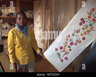 Woman of the Betsileos people producing handmade paper with flowers, Ambalavao, Madagascar Stock Photo