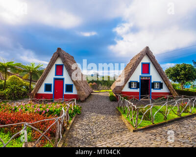 Traditional folk village with artistic cottage houses in Santana region of Madeira, Island of Portugal Stock Photo
