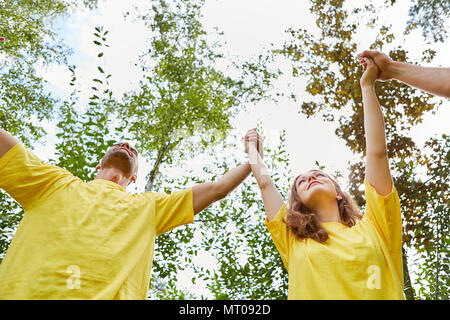 Young people are doing a team building exercise in the team building workshop Stock Photo