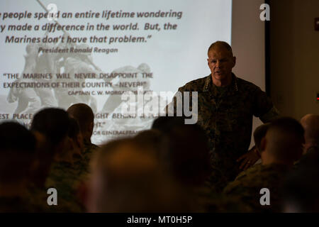 Commandant of the Marine Corps Gen. Robert B. Neller speaks to Marines at Marine Corps Air Station Yuma, Ariz., July 7, 2017. Gen. Neller spoke to the Marines about how they should treat each other and the importance of our culture. (U.S. Marine Corps photo taken by Lance Cpl. Christian Cachola) Stock Photo