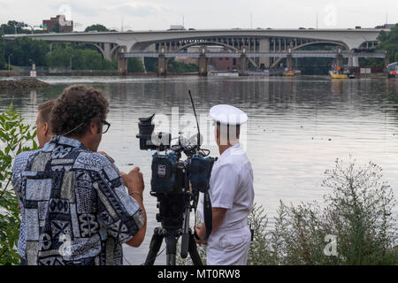 170718-N-CU914-009 MINNEAPOLIS (July 18, 2017) – Looking back on the I-35W bridge, Chief Navy Diver Noah Gottesman, a native of Gaithersburg, Md., reflects back to ten years ago when he was called to assist local, state and federal authorities in finding missing victims in the wake of the bridge collapse while he was attached to Mobile Diving and Salvage Unit (MDSU) 2. Gottesman returned to the area for an interview with NBC KARE 11 reporter Kent Erdahl, during Minneapolis/St. Paul Navy Week. Navy Week programs serve as the Navy's principal outreach effort into areas of the country without a s Stock Photo