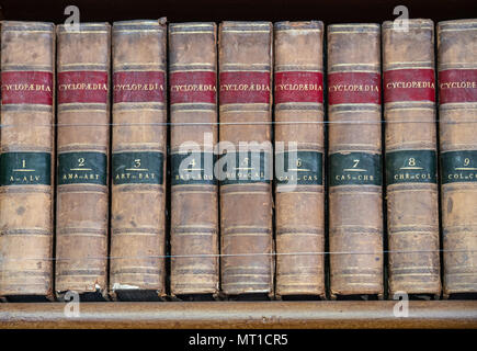 Set of old reference books on a shelf Stock Photo