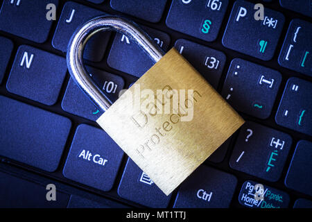 Golden padlock on computer laptop keyboard with Data Protection engraved. Concept of Internet security, data privacy, cybercrime prevention. Stock Photo