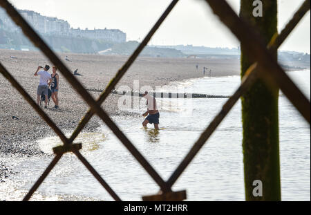 Brighton UK 28th May 2018 - An early morning swimmer cools off in the sea off Brighton beach before thousands of visitors are expected on Bank Holiday Monday as the hot sunny weather continues but possible thunderstorms are forecast for later in the day Credit: Simon Dack/Alamy Live News