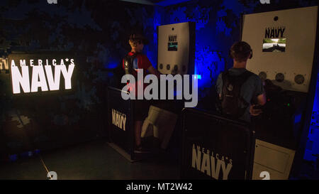 National Jamboree is a large gathering of the Boy Scouts of America held periodically for scouts and leaders. The archival image documents the Navy Experience exhibit at the 2017 National Jamboree on July 21 at Summit Bechtel Reserve near Glen Jean, West Virginia, where participants engaged in a virtual reality Special Warfare Combatant Craft Crewmen scenario. Stock Photo