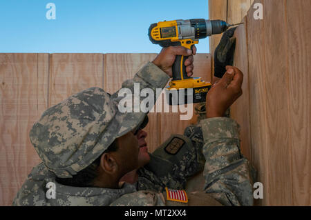 U.S. Army Reserve Spc. Michael Trice, a plumber, and Spc. Lance ...