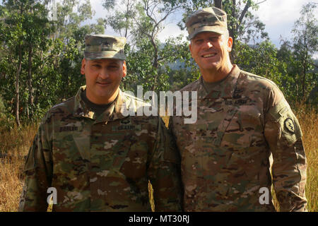 New York Army National Guard Brig. Gen. Joseph Biehler, the 42nd Infantry Division deputy commander of operations poses for a photo with Brig. Gen. Peter Andrysiak, the 25th Infantry Division deputy commander for support at Camp Tiger Hill at Shoalwater Bay, Queensland, Australia, during Combined Exercise Talisman Saber, July 19. For the exercise, more than 700 Soldiers from the 42nd Division's 27th Infantry Brigade Combat Team traveled to Australia where they worked closely with 25th Division, Australian Army, and New Zealand service members. (U.S. Army National Guard photo by Sgt. Alexander  Stock Photo