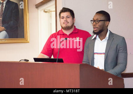 Unmanned aerial vehicle is an aircraft operated without a human pilot onboard and used in research and defense applications. The United States Army Research Laboratory is located at Aberdeen Proving Ground, Maryland. This archival image records University of Maryland students presenting a competition-winning unmanned aerial vehicle on July 17, 2017. Stock Photo