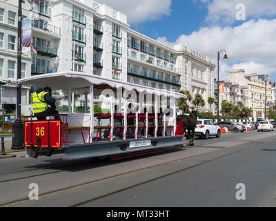 Douglas Bay Horse Tramway transport on Harris promenade passing sea front hotels Douglas Isle of Man taking tourists on the 2.6km journey from Victori Stock Photo