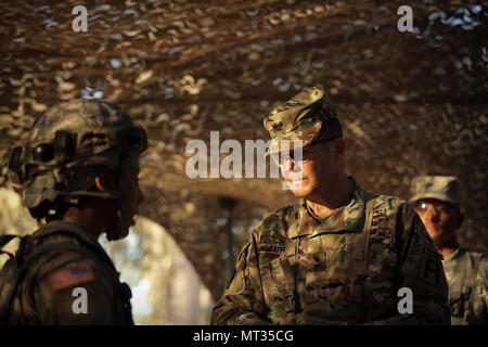 Maj. Gen. Todd McCaffrey, right, commanding general of First Army Division East, meets with Army Reserve Capt. Ciera Jackson, commander of the 208th Transportation (Palletized Loading System) Company based in Marana, Arizona, during Combat Support Training Exercise 91-17-03, July 18, 2017, at Fort Hunter Liggett, Calif. The 208th Transportation Company is an Army Early Response Force unit that must be ready to deploy with very short notice. Approximately 5,000 Army Reserve and National Guard forces participated in the exercise. First Army provided about 65 observer coach/trainers to augment th Stock Photo