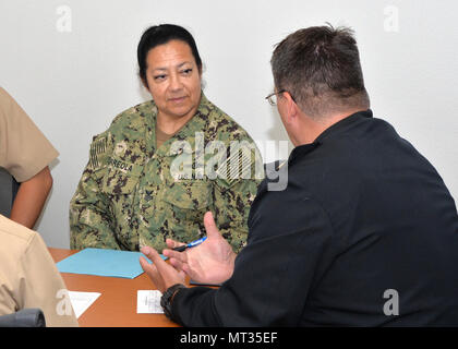 170725-N-UN340-015 SAN DIEGO (July 25, 2017)  Yeoman 1st Class Beatriz Arreola, assigned to Joint Tactical Networking Center San Diego receives advice during a  career development board facilitated by Space and Naval Systems Command (SPAWAR) Command khaki leadership.  Career development boards provide Sailors with the guidance necessary to make informed career decisions based on current Navy policies, programs and procedures. (U.S. Navy photo by Rick Naystatt/Released) Stock Photo