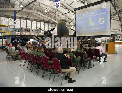 First Lt. Byron Gray, 3d Airlift Squadron pilot, emcees a Hangar Talk June 6, 2017, at the Air Mobility Command on Dover Air Force Base, Del. This was the inaugural Hangar Talk and was hosted by Col. Ethan Griffin, 436th Airlift Wing commander. (U.S. Air Force photo by Senior Airman Zachary Cacicia) Stock Photo