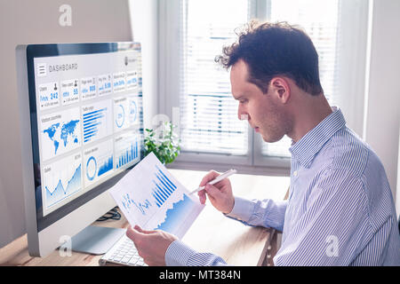 Digital marketing analytics technology with metrics and key performance indicators dashboard on computer screen, person analyzing data chart and adver Stock Photo