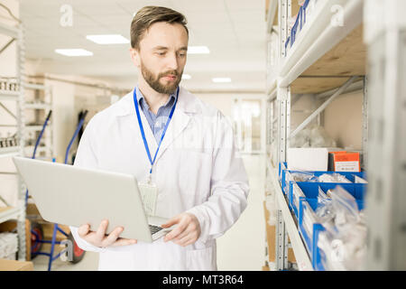 Modern technical engineer preparing goods for export Stock Photo
