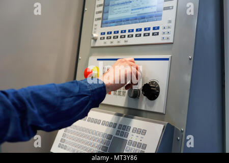 Adjustment of CNC machine operation parameters. Selective focus. Stock Photo