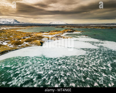 Snow on frozen Lake Myvatn. Stock Photo