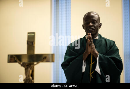 Chaplain (Capt.) John Appiah, 455th Air Expeditionary Wing, leads a prayer during a religious service at Hamid Karzai International Airport, Kabul, Afghanistan, July 23, 2017. Religious support teams from the 455th AEW provide spiritual support in seven locations in Afghanistan. (U.S. Air Force photo by Staff Sgt. Benjamin Gonsier)