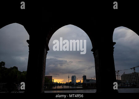 The sun sets over the River Spree. Seen from Oberbaum Bruecke, Berlin, Germany. Stock Photo