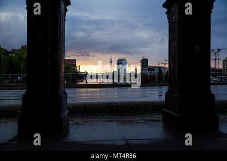 The sun sets over the River Spree. Seen from Oberbaum Bruecke, Berlin, Germany. Stock Photo