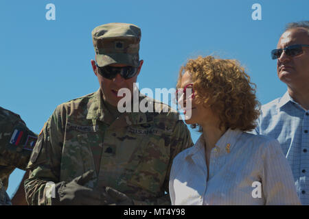 US Army Lt. Col. Mark Himes, commander of the Regimental Engineering Squadron, 2nd Cavalry Regiment, explains how the Macedonian military and the US Army's Regimental Engineering Squadron are working together to Radmila Sekerinska, minister of defense for the Republic of Macedonia, during a distinguished visitors' day at Krivolak Training Area, Macedonia on July 31, 2017. The Regimental Engineering Squadron is currently working in Macedonia as a part of Dragoon Guardian, an offshoot of Operation Atlantic Resolve, which is a NATO mission involving the US and Allied and partnered nations in Euro Stock Photo