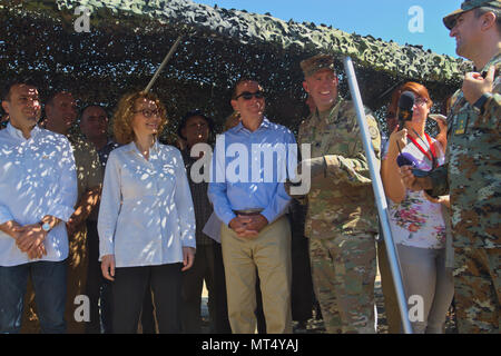 (front row, from left to right) Zoran Zaev, Prime Minister of the Republic of Macedonia, Radmila Sekerinska, Minister of Defense for the Republic of Macedonia, Jess L. Baily, American ambassador to Macedonia, and US Army Lt. Col. Mark Himes, commander of the Regimental Engineering Squadron, 2nd Cavalry Regiment, are briefed on the ongoing construction of a runway for Macedonian Unmanned Aircraft Systems being built by the Regimental Engineering Squadron and Macedonian forces, during a distinguished visitors' day at Krivolak Training Area, Macedonia on July 31, 2017. The Regimental Engineering  Stock Photo