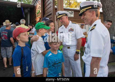 170728-N-CU914-329 GREEN BAY, Wis. (July 28, 2017) – David Robinson Jr.,  Command Master Chief, USS Green Bay (LPD 20), presents Green Bay Packers  linebacker Clay Matthews III with a ship's ball cap