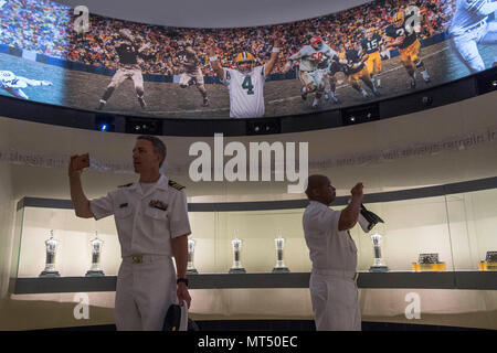 170728-N-CU914-107 GREEN BAY, Wis. (July 28, 2017) – Cmdr. Brian Badura of Fleet Forces Command, and David Robinson Jr., Command Master Chief, USS Green Bay (LPD 20), take a moment to capture some photos in the Green Bay Packers Hall of Fame during Green Bay/Fox Cities Navy Week. Navy Week programs serve as the U.S. Navy's principal outreach effort into areas of the country that lack a significant Navy presence, helping Americans understand that their Navy is deployed around the world, around the clock, ready to defend America at all times. (U.S. Navy photo by Mass Communication Specialist 2nd Stock Photo