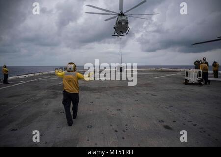 PACIFIC OCEAN (July 31, 2017) Aviation Boatswain Mate Handling 3rd Class Esmerelda Hernandez, a native of Corpus Christi, Texas, assigned to the Air department aboard the amphibious transport dock ship USS San Diego (LPD 22), directs a UH-1Y Venom, assigned to Marine Medium Tiltrotor Squadron (VMM) 161 (reinforced) on the ship’s flight deck. San Diego, part of the America Amphibious Ready Group, with embarked 15th Marine Expeditionary Unit, is operating in the Indo-Asia Pacific region to strengthen partnerships and serve as a ready-response force for any type of contingency. (U.S. Navy photo b