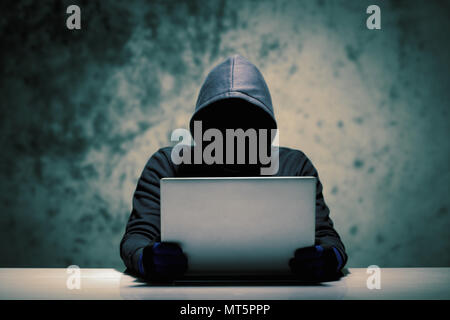 Hackers with computer data theft in the social world. Stock Photo