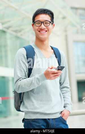 one happy confident young Chinese college student in campus Stock Photo